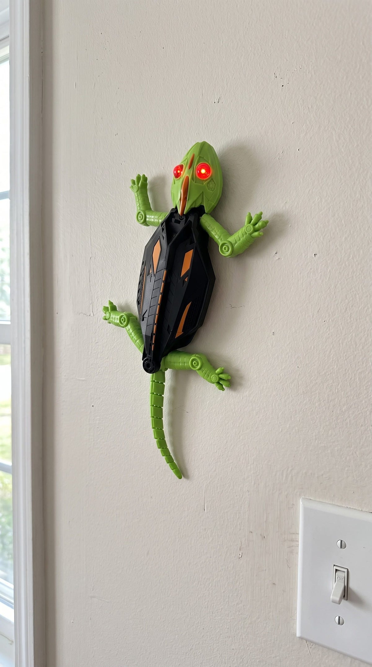 Gecko climbing the wall